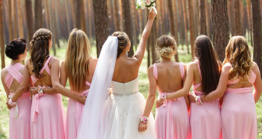 A group of bridesmaids with different, unique hairstyles perfect for any wedding.